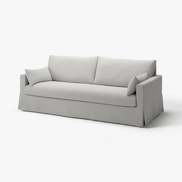 Modern light grey sofa with clean lines; soft cushions; reversible back; upholstered in cotton-polyester blend.