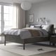 Grey IDANÄS bed with high headboard, pendant lamp, neat linens, large window, bedside table, slippers on cream rug