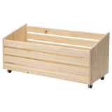 IVAR wooden storage box on wheels. Light natural wood colour. Rectangular, simple design.