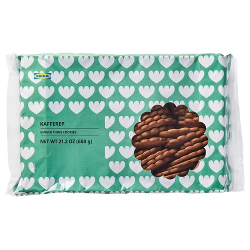 A package of IKEA KAFFEREP ginger thins cookies, featuring a green, heart-patterned background with stacked cookies.