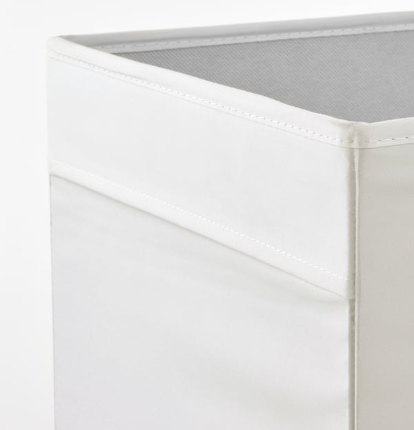 Close-up of KALLAX storage boxs sturdy stitching and textured fabric.