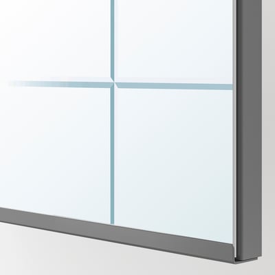 Modern mirror door close-up; sleek frame, reflective glass, clean design.