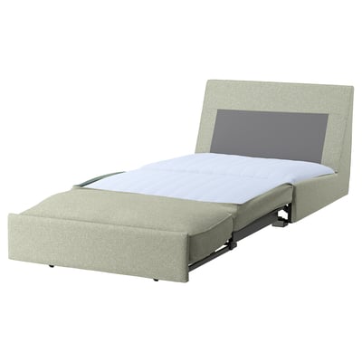 A KIVIK sofa-bed in grey with a compact design, perfect for small spaces. It a removable, machine-washable cover and transforms easily into a bed.