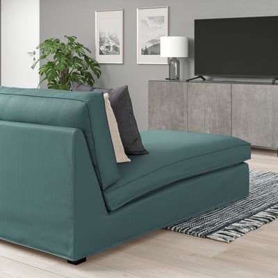 Modern living room with teal KIVIK chaise, lamp, tv, and minimalist decor.