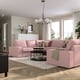 Modern living room with large KIVIK pink sofas, a grey rug, and white curtains. Light wood floors, and a chandelier.