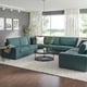 Spacious living room with large teal KIVIK sectional sofa, white rug, wood floor, modern decor, and large windows.