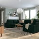 Modern living room with green KIVIK sofa, striped rug, and natural light. Cosy and inviting space.