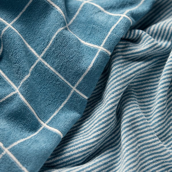 Blue and white chequered cloth; soft texture; neatly folded.