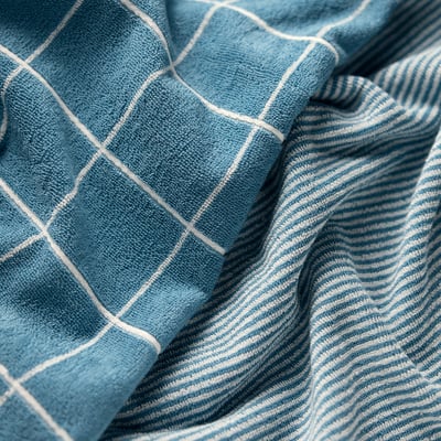 Blue and white chequered cloth; soft texture; neatly folded.