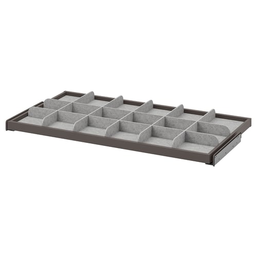 KOMPLEMENT grey organiser tray with multiple compartments for storing accessories and small items, made from durable materials.