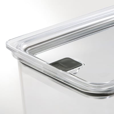 Clear plastic food storage jar with airtight lid, visible locking mechanism, sleek design.