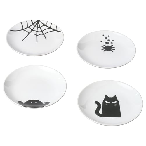 Four white KUSTFYR plates, each with black halloween-themed designs in different positions. Made of stoneware.