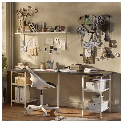 Home office setup with LAGKAPTEN desk, chair, and shelves. Wood and metal design, various items organised on desk and shelves.