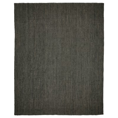An ikea LANDBANA rug, rectangular, dark green in color, made of natural jute.