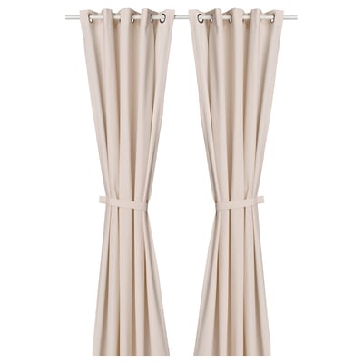 Pink curtains with dark specks, tiebacks, & stainless eyelets.