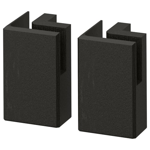 Two black rectangular wooden blocks with angled top and bottom edges, likely kitchen decor or supports.