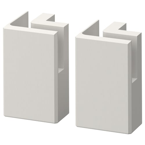 Two white rectangular wooden blocks with bevelled edges and inset panels, stacked side by side.