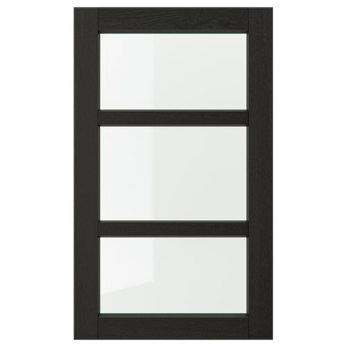 A black LERHYTTAN glass kitchen cabinet door with a solid wood frame and bevelled edges, featuring three sections of clear tempered glass.
