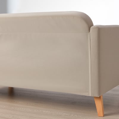 Modern beige sofa with wooden legs; compact yet cosy, fits well in small rooms.