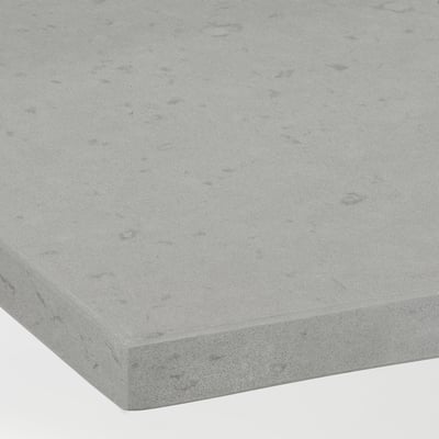 Smooth, speckled grey recycled glass countertop, finely textured, shows subtle natural variations.
