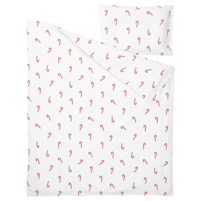 A white bedding set with red candy cane print, made of cotton. Includes a duvet cover and a pillowcase, perfect for holiday decor.