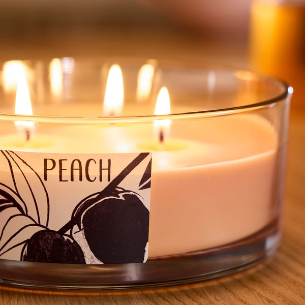 LOTSFÅGEL Scented cndl in glass w lid/3 wicks, Peach light orange, 25 hr
