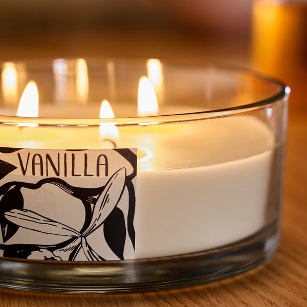 LOTSFÅGEL Scented cndl in glass w lid/3 wicks, Vanilla pale beige, 25 hr