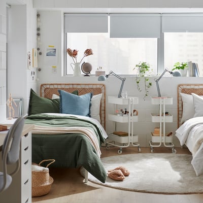 A luxurious green waffle-textured bedding set, featuring soft cotton and cosy filling, neatly arranged on a bed.