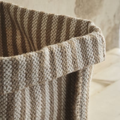 Handwoven jute basket with natural tones, durable & textured, perfect for storage.