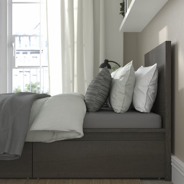 Modern bed with high headboard, reading/tv spot, two large storage drawers with castors.