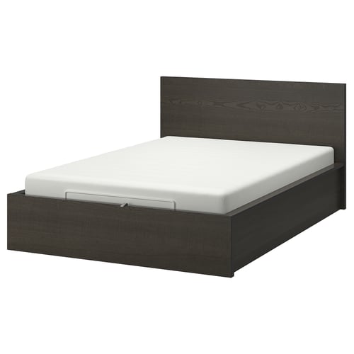 Black wooden bed with white mattress. Modern design, high headboard, storage underneath.