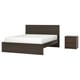 It shows a dark brown MALM bed with a high headboard and a matching dark brown storklinta bedside table, both featuring clean, modern designs.