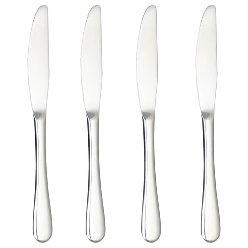 Four stainless steel knives in a row, sleek and polished, ideal for elegant dining.