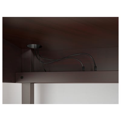 Wooden desk with a cable management system and adjustable shelf.