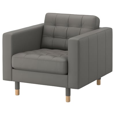 Grey MORABO armchair with tufted back and seat, wooden legs, leather and fabric upholstery.