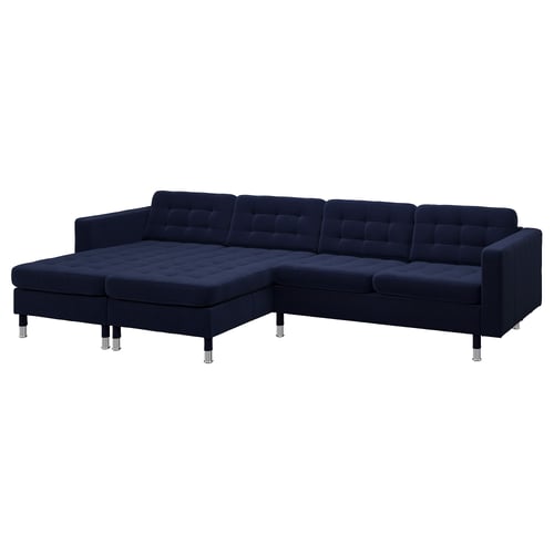 Modern navy l-shaped sofa, chrome legs, tufted deep blue cushions.