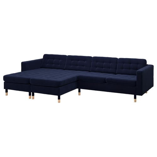 Navy blue modern l-shaped sofa with tufted cushions and wooden legs.