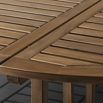 Close-up of NÄMMARÖ tables sleek, slatted acacia wood surface, showcasing its smooth, durable finish and elegant design.