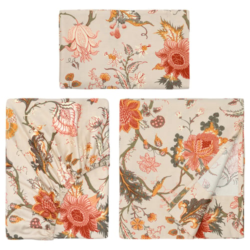 Three beige pillows with orange, pink flowers, green leaves.