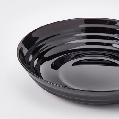 Black glossy glass bowl with smooth, rounded edges and reflective surface.