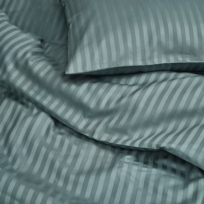 Teal bedding set with smooth, lustrous stripes, showcasing high-quality fabric and elegant design.