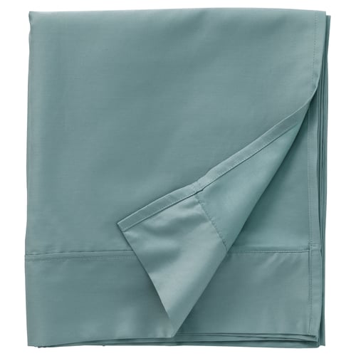 Folded blue-green NATTJASMIN bedsheet with pleated edge, smooth texture, made of cotton and lyocell.