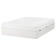 A NORDLI white bed frame with six drawers for storage, designed for compact spaces.