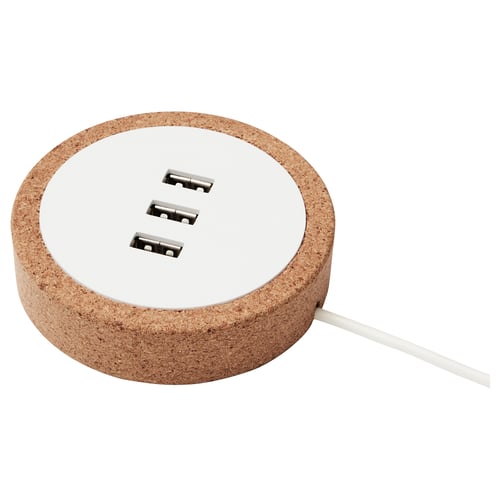 A NORDMÄRKE usb charger made of sustainable cork with three ports, designed to be integrated into furniture.