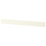 A white ikea NYTTIG hob separator. Its a slim, rectangular piece designed to protect the hob and organize utensils.