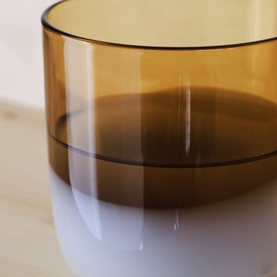 Amber glass, smooth edges, reflected light, polished surface.