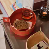OMMJÄNGE red tray with bread, teacup, candle; birch veneer, sturdy, decorative teardrop shape.