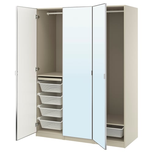 A beige IKEA PAX wardrobe with mirrored doors, featuring pull-out trays and baskets for storage.