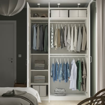 Open wardrobe with hangers, shelves, and adjustable feet.