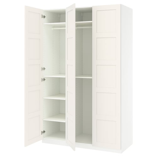 An open white PAX wardrobe with multiple shelves inside.